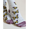 Model wearing Grey Tabbysocks Monarch Butterfly Socks - Unisex