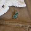 Green floral rabbit enamel pin designed by Justine Gilbuena