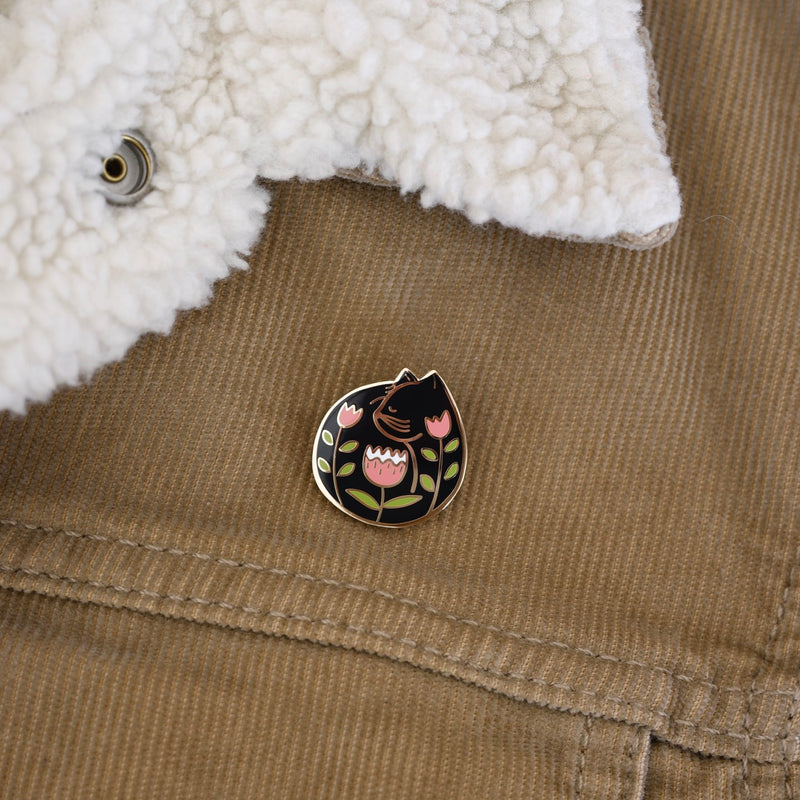 Black cat enamel pin designed by Justine Gilbuena 