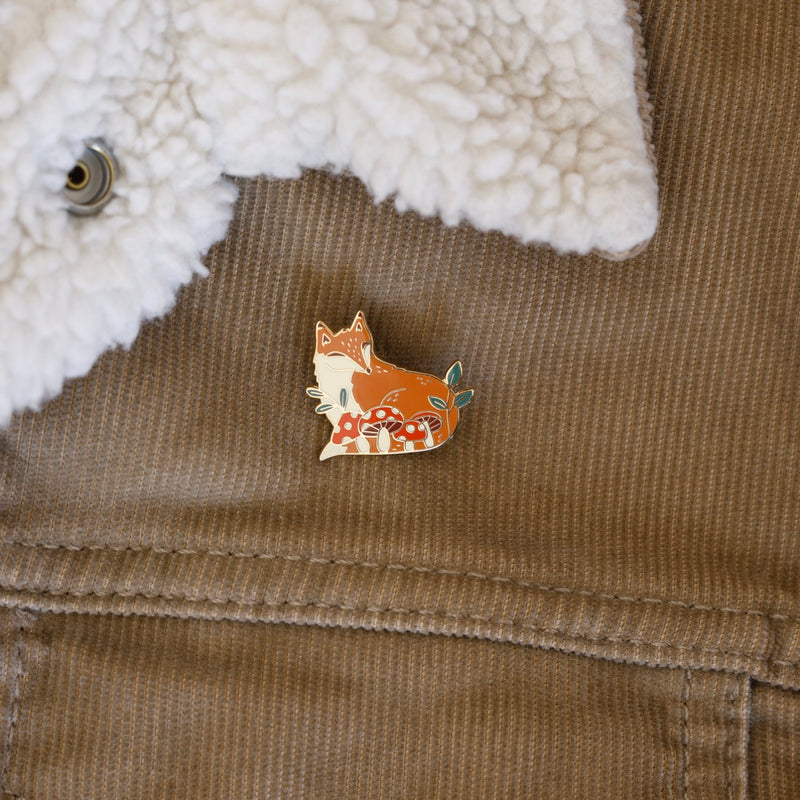 Fox with mushrooms enamel pin designed by Justine Gilbuena