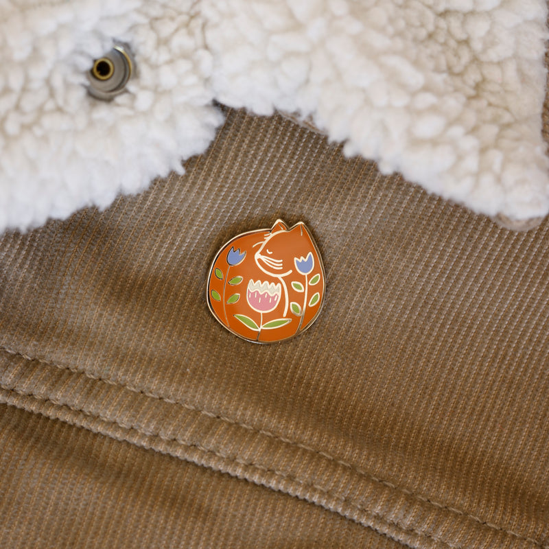 Orange cat enamel pin designed by Justine Gilbuena