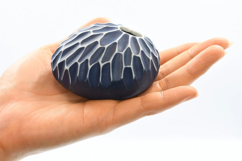 PEBBLE Indigo Mini Porcelain Bud Vase in hand