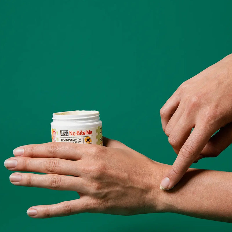 SallyeNo-Bite-Me All Natural Bug Repellent & Anti-Itch Cream- two hands showing how to apply