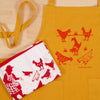 Kei & Molly Chicken Apron close up shown with our chicken Free Range Dish Towel