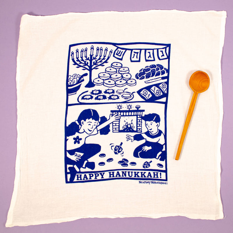 Kei & Molly Flour Sack Dish Towel, Happy Hanukkah! full view shown with cooking spoon for comparison.