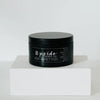 Palo Santo + Sage Candle by Upside Goods Co.  in a black tin; front view with lid on