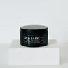 Land of Enchantmint Candle by Upside Goods Co. in black tin; front view with the lid on