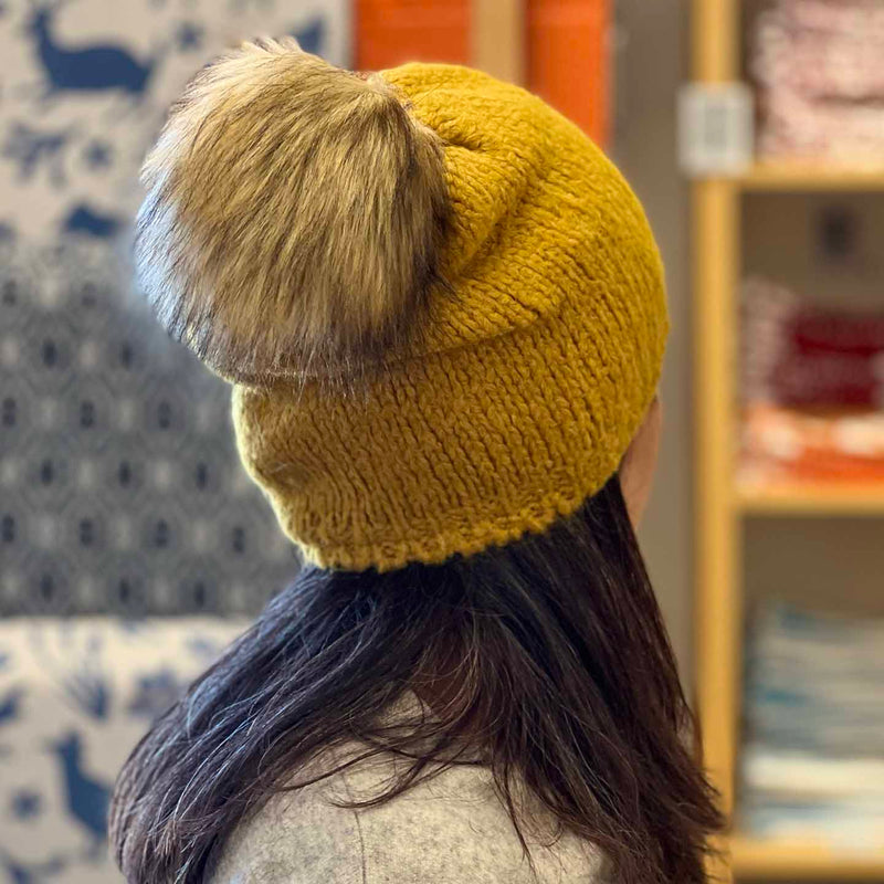 Woolk Wool Winter Hats: Mustard. Model.
