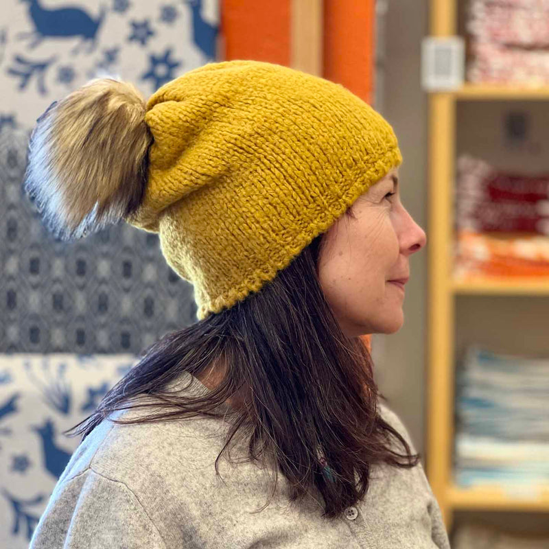 Woolk Wool Winter Hats: Mustard. Model.