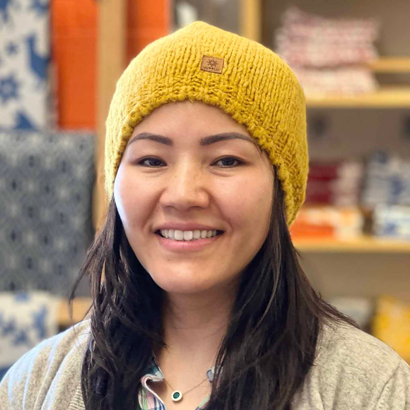 Woolk Wool Winter Hats: Mustard. Model.