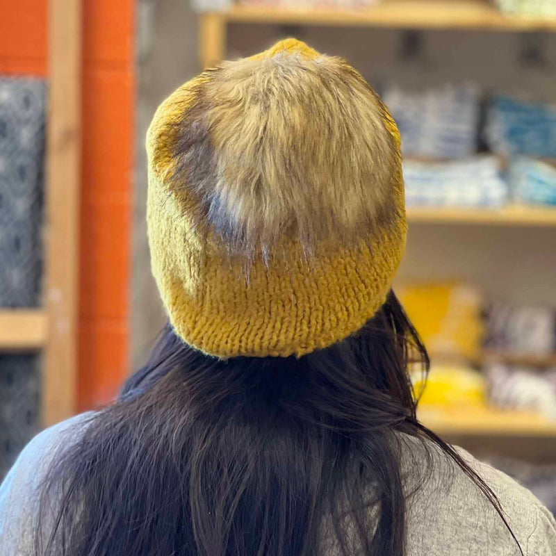 Woolk Wool Winter Hats: Mustard. Model.