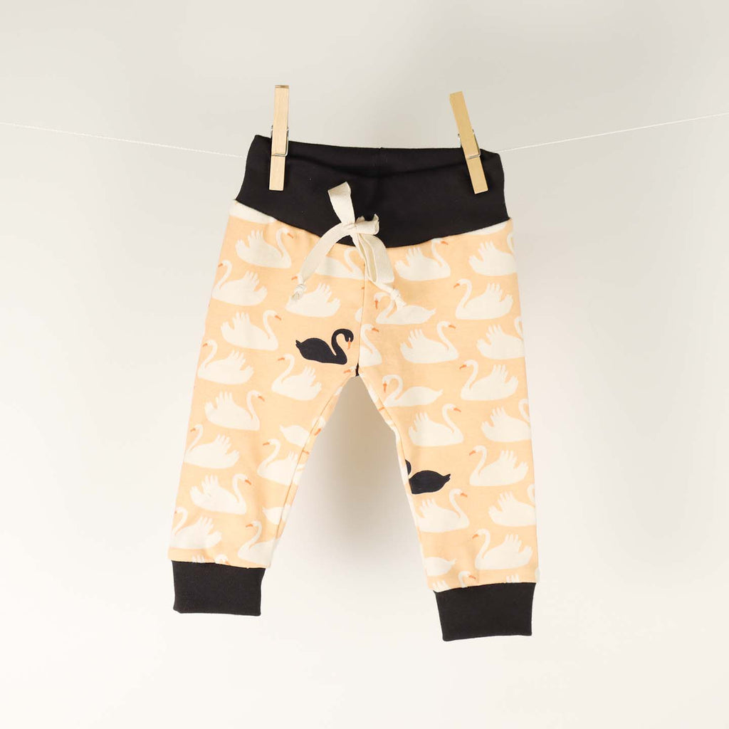 Baby pants by Kinder Sprout: swans, front view.