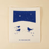 Kei & Molly Textiles Large Sponge Cloth Snowbirds design printed in Navy Blue: three birds in the snow under a night sky full of stars. 