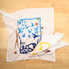 Kei & Molly Immigration/Migration Flour Sack Dish Towel in Two Tone Yellow and Blue with Props