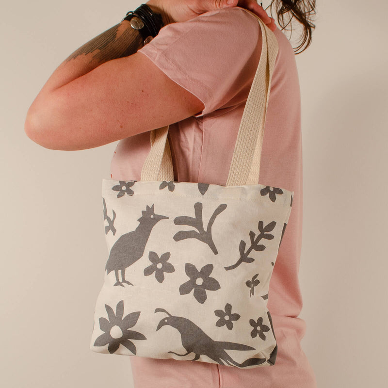 Model posing with Kei & Molly Textiles Mini Tote Bag with Buffalo & Friends Design in Grey