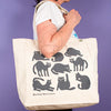 Kei & Molly Tote Bag with Cats Design in Grey Held by Model