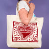 Kei & Molly Tote Bag with Milagro Design in Red Held by Model