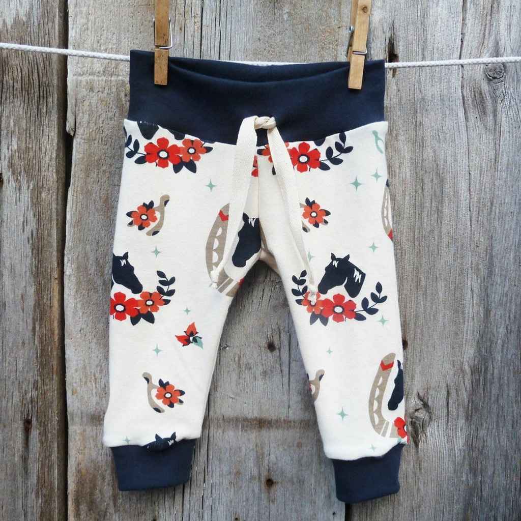 Baby pants by Kinder Sprout: horse shoes and horses, front view