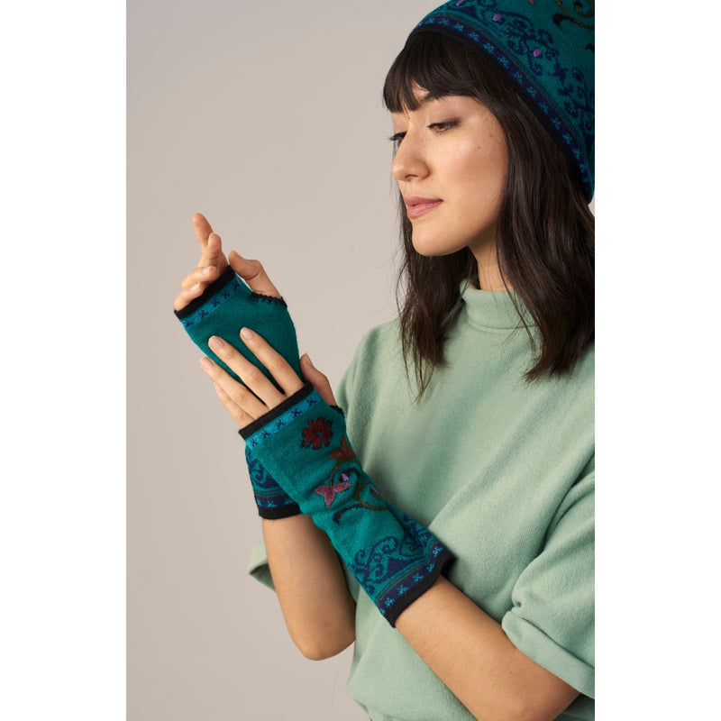 WUAMAN Alpaca Fingerless Gloves- Embroidered. Color Jade. Model posing.