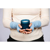B. B Sheep cashmere fingerless gloves in light blue. Model holding a candle.