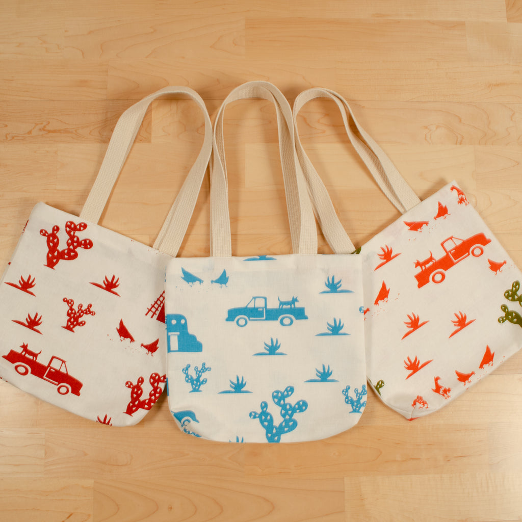 Kei & Molly Tote Bags “Pueblo” design printed in four different colors.