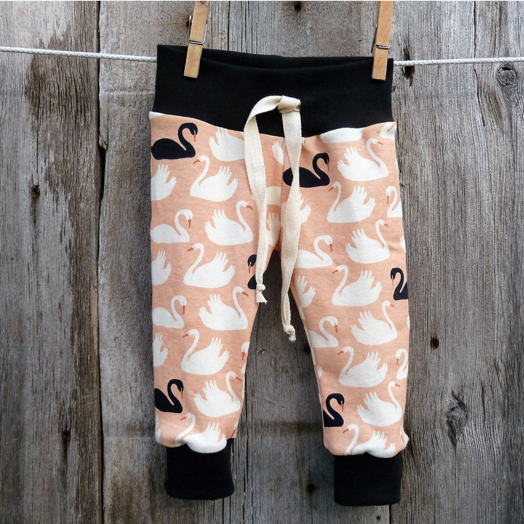 Baby pants by Kinder Sprout: swans, front view